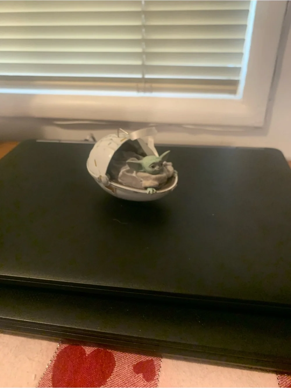 The Child in Floating Pod Figurine - Green & White ornament
